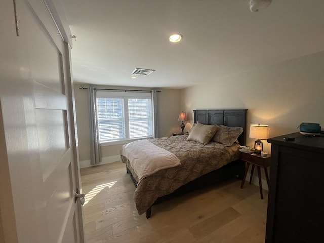 bedroom with light hardwood / wood-style floors