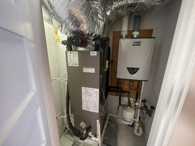 utility room featuring tankless water heater