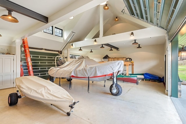 interior space with concrete flooring, lofted ceiling with beams, and billiards