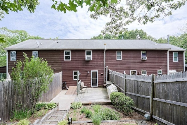 330 Thurston St Unit 330, Wrentham, MA 02093 - rear view of house featuring a fenced backyard, a deck, and cooling unit