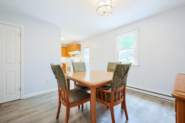 330 Thurston St Unit 330, Wrentham, MA 02093 - dining area featuring baseboard heating and light wood-style flooring