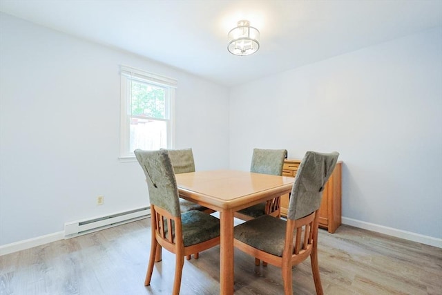 330 Thurston St Unit 330, Wrentham, MA 02093 - dining space featuring a baseboard heating unit, light wood-type flooring, and a chandelier
