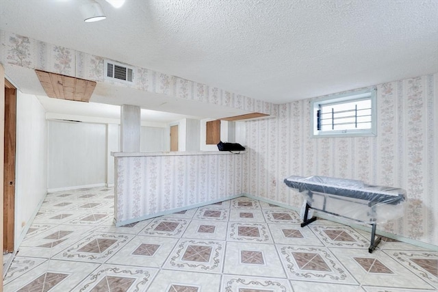 interior space featuring a textured ceiling