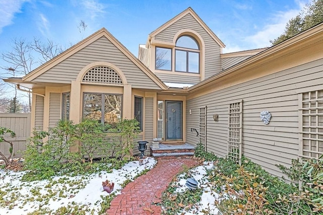 view of snow covered property entrance