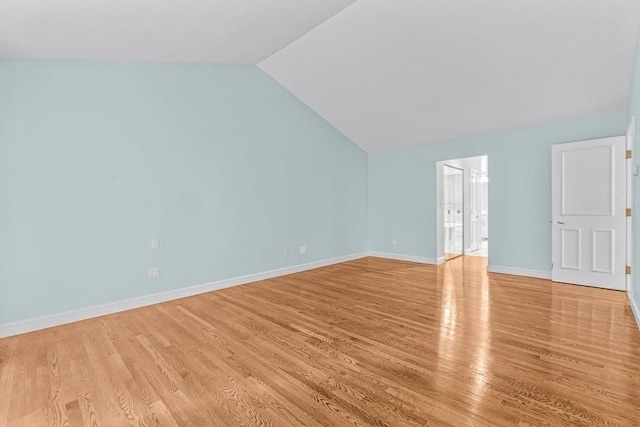 bonus room featuring light wood-type flooring and lofted ceiling