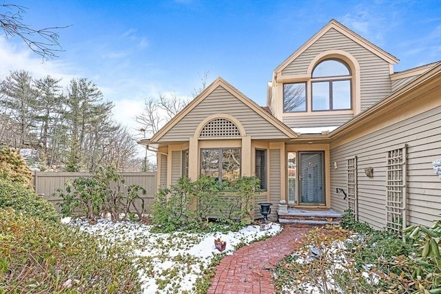 view of snow covered property entrance