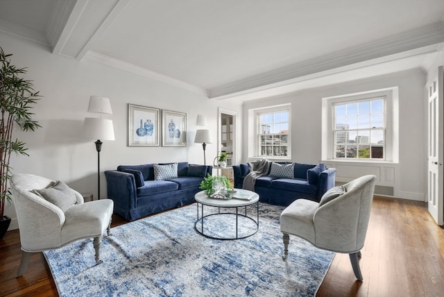 living room featuring ornamental molding, beam ceiling, and hardwood / wood-style flooring