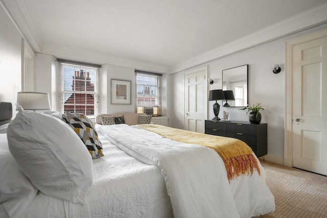 carpeted bedroom with ornamental molding