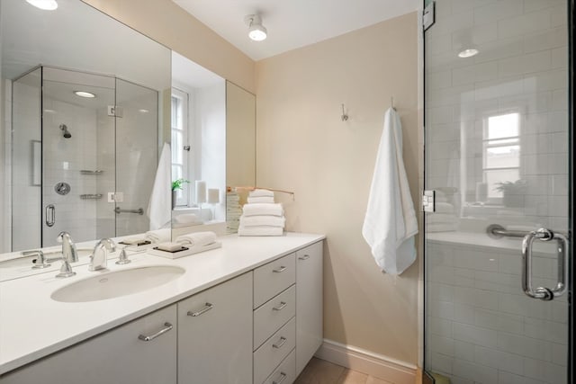 bathroom featuring vanity and walk in shower