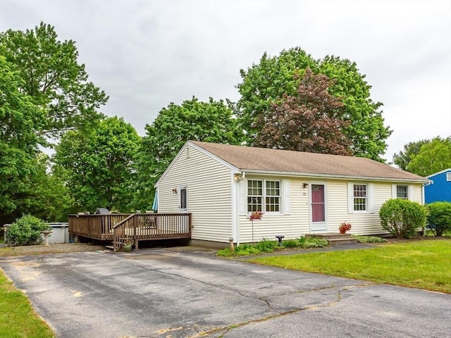22 Bayview Ave, Berkley, MA 02779 - single story home with a wooden deck and a front lawn