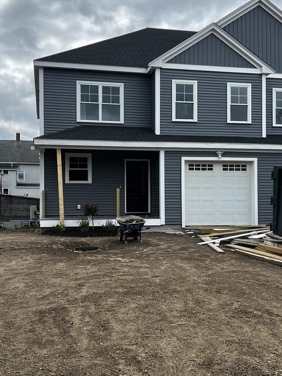 9 Ariana Cir Unit 9, Milford, MA 01757 - view of front of house with a garage, a porch, roof with shingles, and board and batten siding