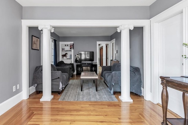 6-8 Maurice Ave, Lawrence, MA 01841 - living room with decorative columns and light wood-type flooring
