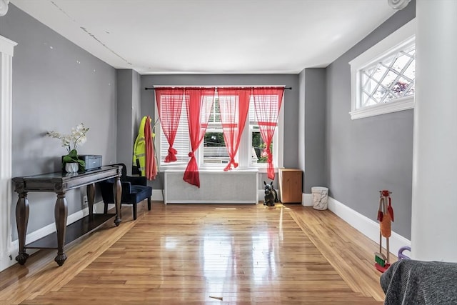 6-8 Maurice Ave, Lawrence, MA 01841 - interior space with radiator heating unit and wood finished floors