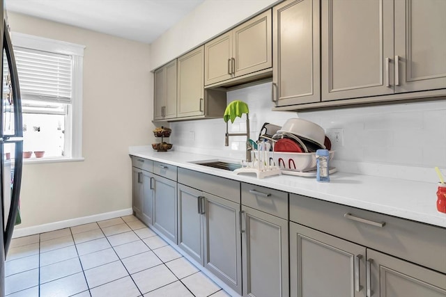 6-8 Maurice Ave, Lawrence, MA 01841 - kitchen with gray cabinetry, light countertops, and light tile patterned floors