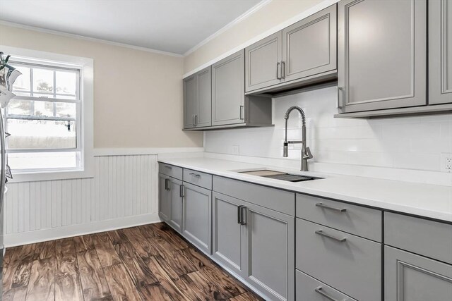6-8 Maurice Ave, Lawrence, MA 01841 - kitchen featuring gray cabinetry, crown molding, a wainscoted wall, light countertops, and decorative backsplash