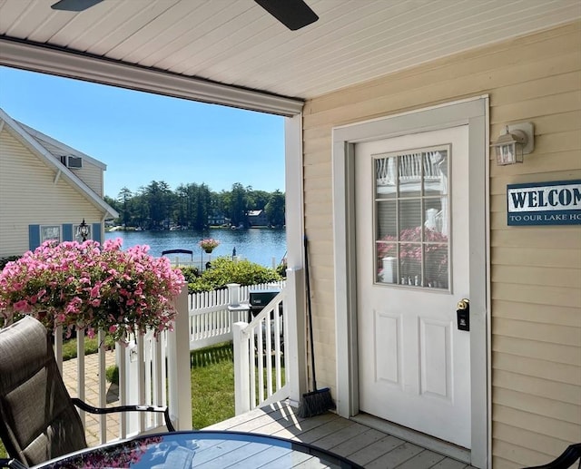 view of exterior entry with a water view