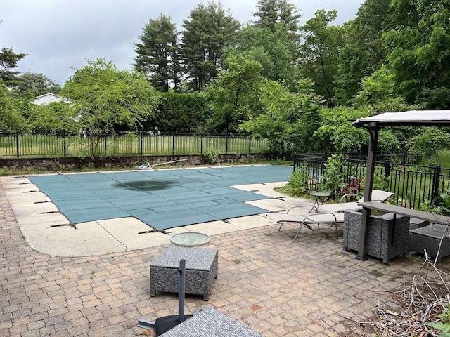 view of pool with a fenced in pool, a patio, and fence