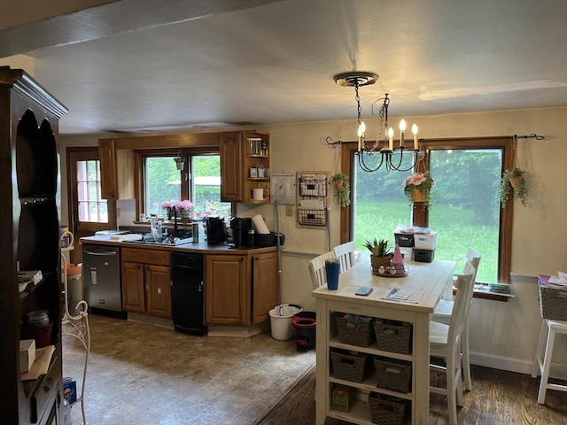 kitchen featuring brown cabinets, open shelves, a sink, stainless steel dishwasher, and an inviting chandelier