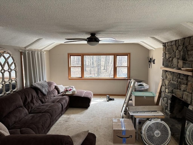 living area with lofted ceiling, plenty of natural light, a fireplace, and carpet floors