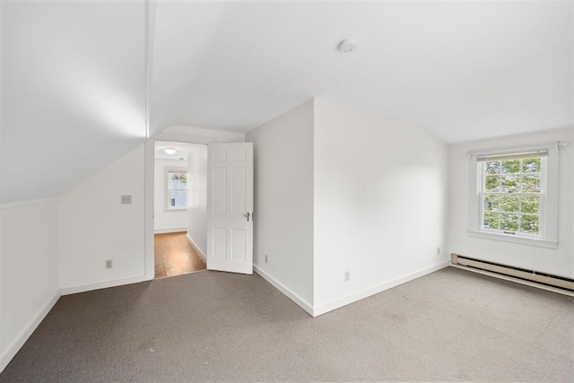 141 Hobart St, Braintree, MA 02184 - additional living space with carpet floors, vaulted ceiling, baseboards, and a baseboard heating unit
