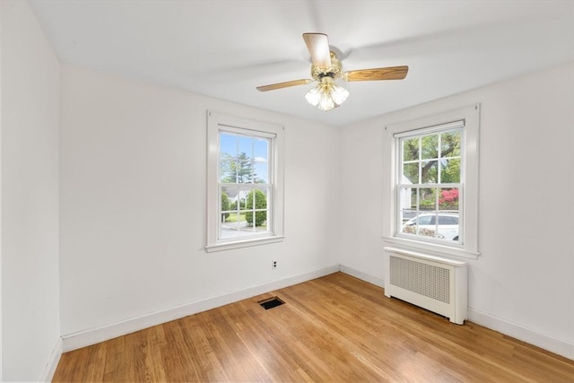 141 Hobart St, Braintree, MA 02184 - unfurnished room featuring radiator heating unit, light wood finished floors, baseboards, and ceiling fan