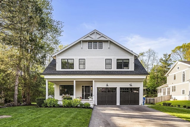 40 Carver Rd, Wellesley, MA 02481 - view of front of home featuring covered porch, asphalt driveway, a garage, and roof with shingles