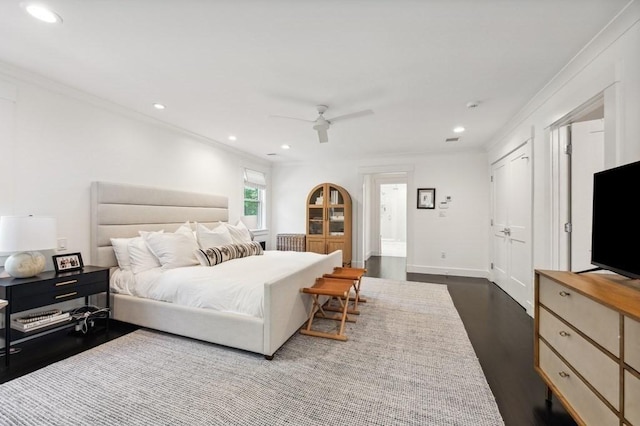 40 Carver Rd, Wellesley, MA 02481 - bedroom with dark wood-style floors, recessed lighting, ornamental molding, a ceiling fan, and multiple closets