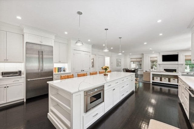 40 Carver Rd, Wellesley, MA 02481 - kitchen featuring stainless steel built in refrigerator, a kitchen island, white cabinetry, open floor plan, and recessed lighting