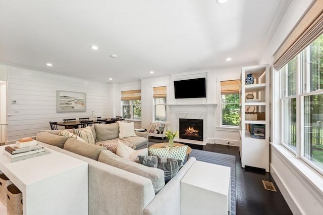 40 Carver Rd, Wellesley, MA 02481 - living room with plenty of natural light, dark wood-style flooring, a premium fireplace, and recessed lighting