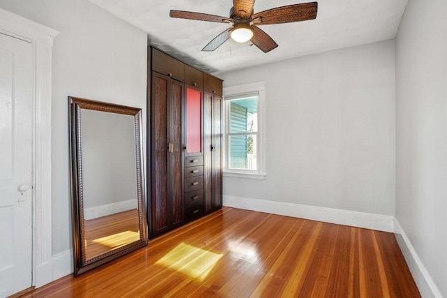1 King St Unit 3, Boston, MA 02122 - unfurnished bedroom with light wood finished floors, baseboards, and a ceiling fan