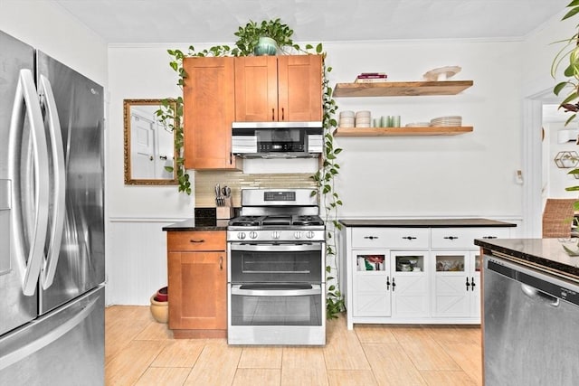 1 King St Unit 3, Boston, MA 02122 - kitchen with appliances with stainless steel finishes, brown cabinetry, a wainscoted wall, crown molding, and open shelves