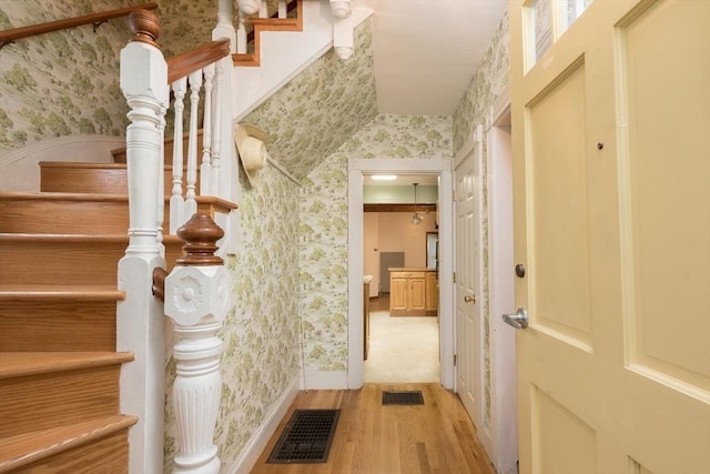 98 Safford St, Quincy, MA 02171 - staircase with wallpapered walls and wood finished floors