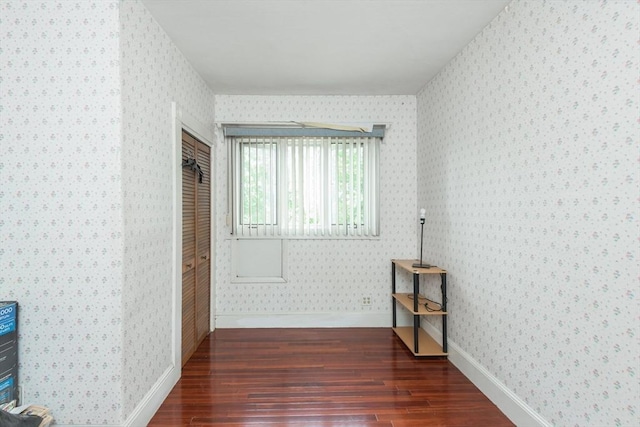98 Safford St, Quincy, MA 02171 - empty room with wood finished floors and wallpapered walls
