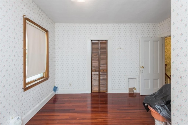 98 Safford St, Quincy, MA 02171 - bedroom featuring wood finished floors, wallpapered walls, and a closet