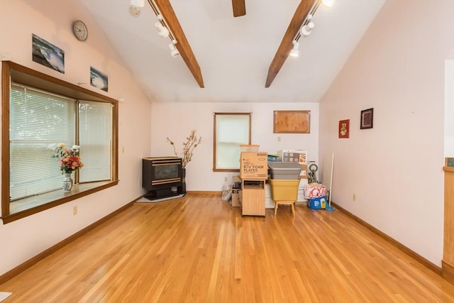 98 Safford St, Quincy, MA 02171 - home office with track lighting, vaulted ceiling, wood finished floors, a wood stove, and ceiling fan