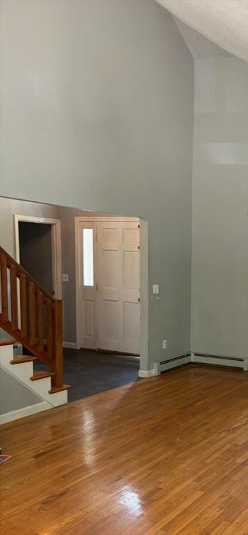 62 Musket, Mashpee, MA 02649 - foyer entrance featuring high vaulted ceiling, stairway, and wood finished floors