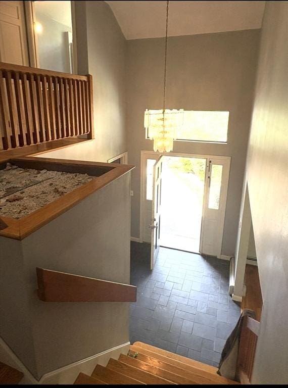 62 Musket, Mashpee, MA 02649 - entrance foyer with a chandelier, stairway, and lofted ceiling