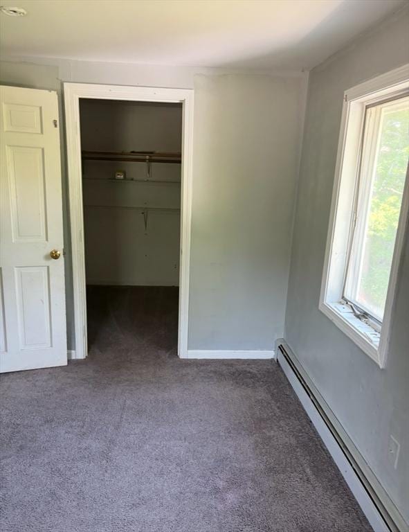 62 Musket, Mashpee, MA 02649 - unfurnished bedroom with a baseboard heating unit, carpet, and a closet