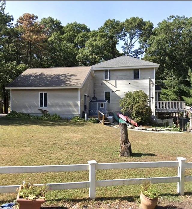 62 Musket, Mashpee, MA 02649 - rear view of house featuring a wooden deck and roof with shingles