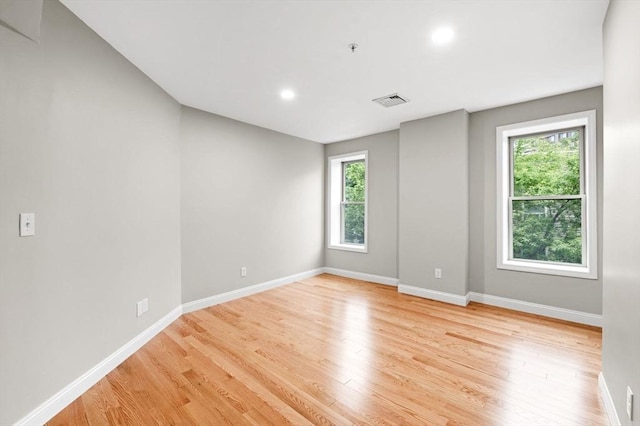 72 River St Unit 5, Haverhill, MA 01832 - unfurnished room with baseboards, light wood-style flooring, and recessed lighting