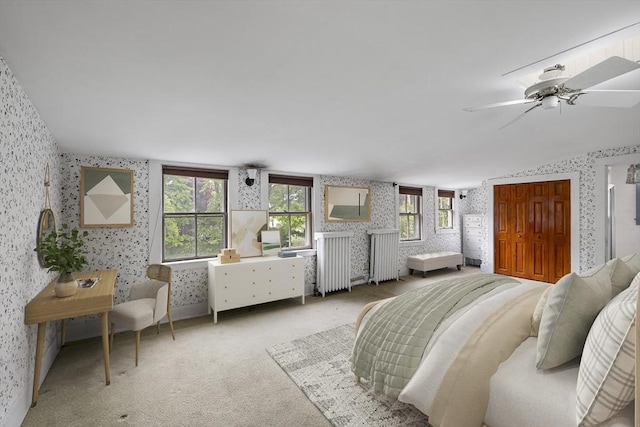 50 Humphrey St, Marblehead, MA 01945 - bedroom with wallpapered walls, radiator heating unit, and a ceiling fan