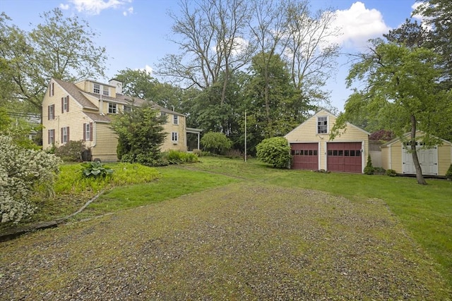 50 Humphrey St, Marblehead, MA 01945 - view of grassy yard with a detached garage
