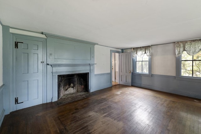 50 Humphrey St, Marblehead, MA 01945 - unfurnished living room featuring a fireplace with flush hearth, wood finished floors, a wainscoted wall, and a decorative wall