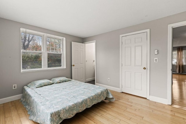 733 W Main Unit G, Barnstable, MA 02630 - bedroom with baseboards and light wood-style flooring