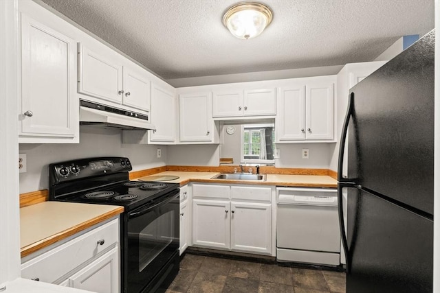 733 W Main Unit G, Barnstable, MA 02630 - kitchen featuring black appliances, under cabinet range hood, a sink, white cabinets, and a textured ceiling
