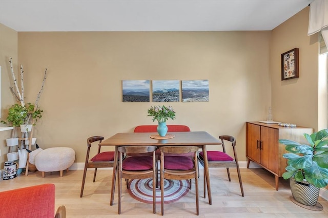 1 Brook Rd Unit 215, Quincy, MA 02169 - dining space with light wood-style flooring and baseboards