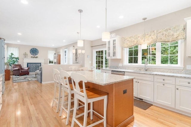 12 Cranberry Ln, Wrentham, MA 02093 - kitchen featuring a sink, light wood finished floors, white cabinetry, glass insert cabinets, and recessed lighting