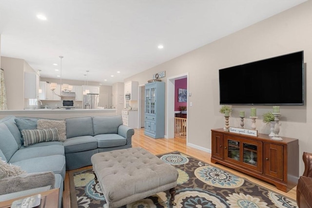 12 Cranberry Ln, Wrentham, MA 02093 - living room featuring light wood-style flooring, recessed lighting, and baseboards