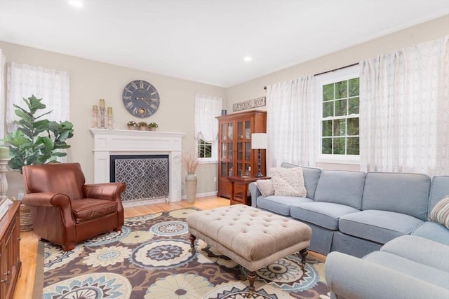 12 Cranberry Ln, Wrentham, MA 02093 - living room featuring light wood-style flooring, recessed lighting, a fireplace with flush hearth, and baseboards