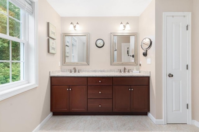 12 Cranberry Ln, Wrentham, MA 02093 - full bathroom featuring double vanity, baseboards, and plenty of natural light